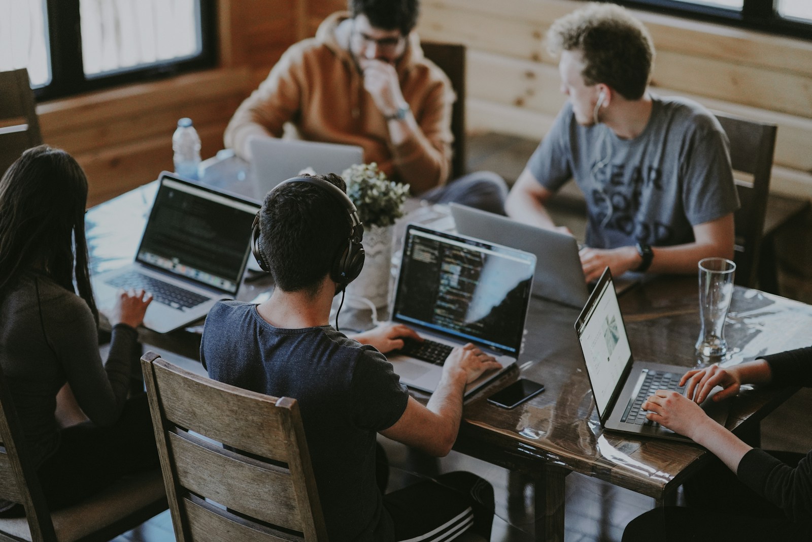 Engineers collaborating at dedicated lab benches in the BuildWithAICo workspace